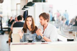 Young couple fighting in cafe