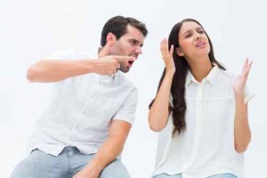 Couple sitting on chairs arguing